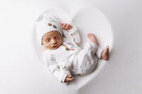 Baby boy posed in a heart in Southern Minnesota. Newborn photos near me, Mankato newborn photography.