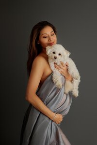 portrait of expecting mother with her dog during artistic Los Angeles maternity portrait