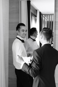 Two grooms getting ready together on their wedding day in San Sebastián