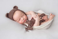 Newborn baby posed in cream bowl setup in New Bern North Carolina studio