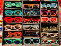 A tray containing 15 pair of colorful retro style sunglasses - Bloom by bel monili
