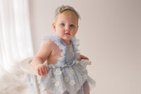 Baby celebrates her first birthday with Cake Smash Pictures at Holy City Babies Portrait Studio in Charleston, SC.