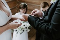 bride and groom exchanging wedding rings