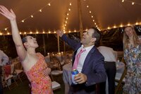 Guests enjoy dancing during tented wedding reception on Nantucket.