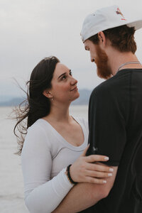 couple holding each other during outdoor engagement photos in georgia
