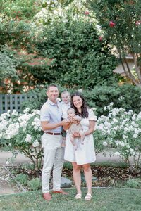 Classic family portrait with toddler and baby at Gamble Gardens rose garden in Palo Alto