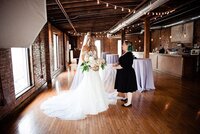 Mahlia chatting with bride on her wedding day