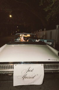 A couple in their getaway car in Charleston, SC