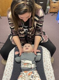 Dr. Lauren providing Chiropractic care for a baby