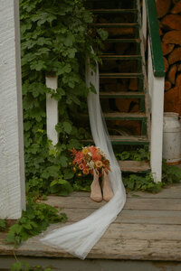 Groom + Bride laughing candidly during summer wedding near Edson, Alberta
