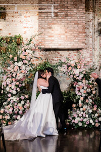 Bride and groom share their first kiss