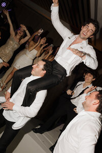 Sophisticated film photography capturing late reception moments during Rebecca & Kevin's fashion forward destination wedding at Miami Beach Edition luxury resort.