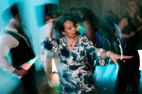 Colourful Wedding photography at Tawstock court reception guest dancing candid style