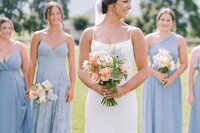 Bridal party with matching peach and blue bridesmaid bouquets by Flowergirl Cville, Charlottesville wedding florist, at King Family Vineyard | Photo by Paige Ryan Photography