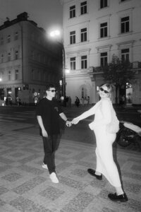 Night couple photoshoot in Prague streets with city lights - moody and cinematic film style
