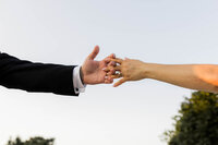 artistic wedding photo of couple holding hands