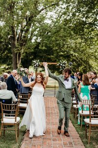 newlyweds-wedding-ceremony-exit-cheering