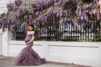 Maternity Photos in Charleston, SC -- Expectant mother poses for Maternity Portraits on Meeting Street in downtown Charleston, SC.