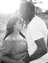 Pregnant mom and her husband embracing during a pregnancy session in Seattle