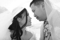 couple foreheads touching gazing into each others eyes