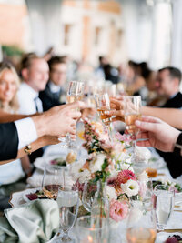 A candid capture of guests toasting at Cairnwood Estate, highlighting genuine connection.