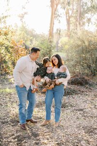 Bay Area family laughing together in natural light during an outdoor portrait session