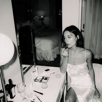 superherodesignco_34572_Bride_applying_lipstick_while_looking_5efb34e8-a05b-4be9-9370-57566d46d9a3_0