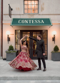 Boston micro wedding for multicultural couple with reception at contessa boston. Groom spin indian bride.