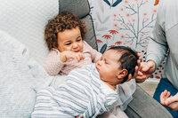 older-sibling-meeting-newborn-baby-sibling-love