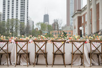 Wedding reception table with flowers and chairs, captured by wedding photographer in Cincinnati, Ohio