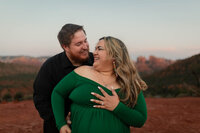 Couple laughing and embracing during their Lover's Knoll engagement session in Sedona