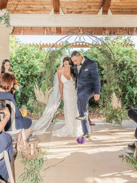 A groom breaks a glass during a Jewish wedding in Sonoma, California