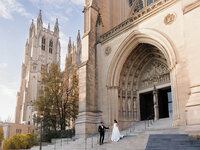 A couple holding hands in front of the Washington National Cathedral, demonstrating refined composition and the natural unfolding of a wedding day.