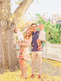 Family portrait with kids and leaves