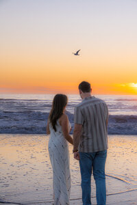 ocean dancing couple watching bird in santa cruz