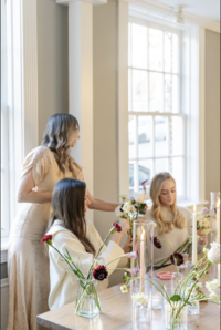 Three women designing centerpieces at Maison Charlottesville. Photography by Jo Mahoney