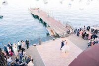 Bride and groom during first dance on dance floor outdoors at West Shore Cafe