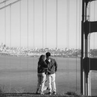 young couple embracing at battery spencer in san francisco