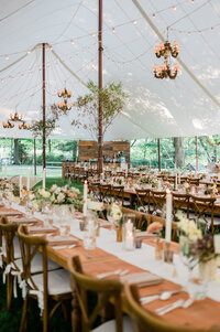 Outdoor reception table with floral centerpieces