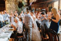 Couple walking into their wedding reception in Jackson, NH