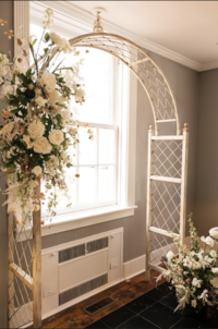 Floral wedding arch by Charlottesville florist, Flowergirl Cville at Maison Charlottesville. Photography by Amy Mitchell.