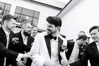 Groom walking with groomsmen before ceremony in Smoky Mountains