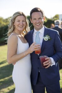 Guests enjoy outdoor cocktail hour during Nantucket wedding reception.