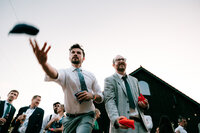 colourful and candid wedding photography at froginwell vineyard guests having fun playing garden games