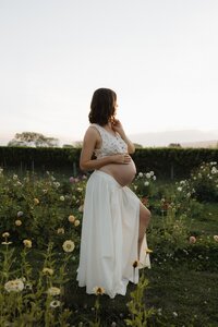 Maternity session in Christchurch at sunset with flowers