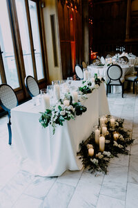 Exquisite table decor setup, capturing the essence of the wedding theme through its elegant arrangement and attention to detail.
