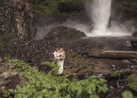 Couple eloping at the base of Latourell Falls in the Columbia River Gorge.