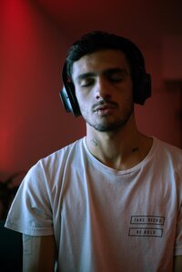 Man wearing over-ear headphones practicing daily nervous system support through sound-based therapy