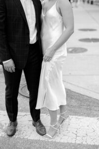 Black and white detail of bride and groom standing together captured in Detroit wedding photography
