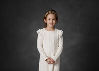 young-girl-in-portrait-studio-on-dark-background
